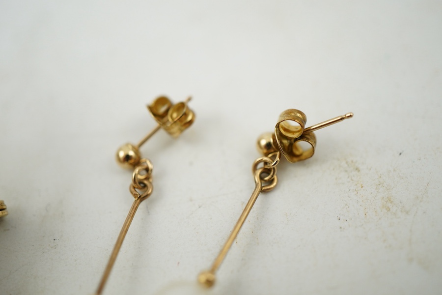 A group of cultured pearl jewels, comprising: two pairs of cultured pearl drop earrings, longest 3cm, mounted in gold; and two cultured pearl brooches mounted in 9ct gold, longest 4.1cm, British hallmarks, combined gross